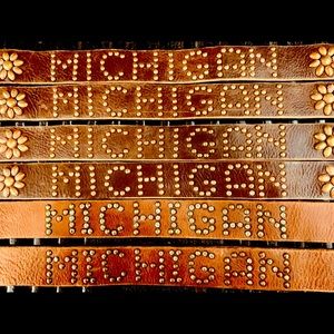 Vegetable tanned leather with hand distressed/corroded studs.